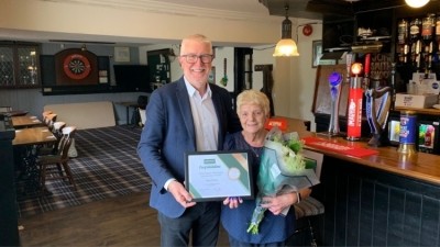 Incredible achievement: Licensee marks 50 years at the Grey Horse pub (Pictured: Chris Jowsey with June Dixon) 