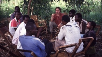 Social skills developed: Greg Pilley sharing drink with villagers in Uganda